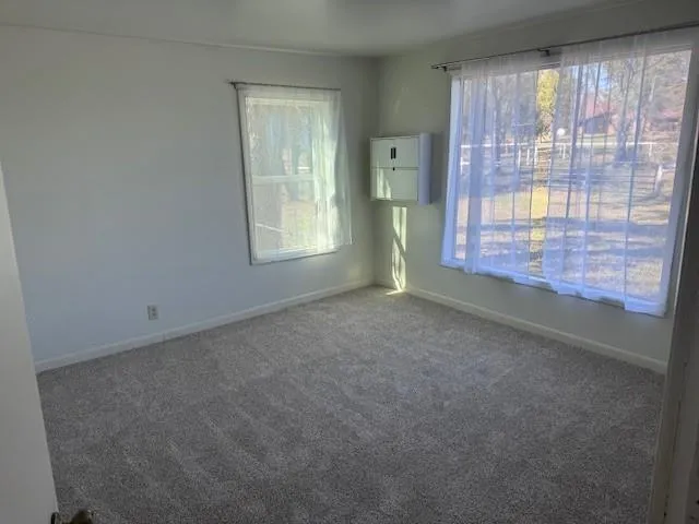 a view of an empty room with a window