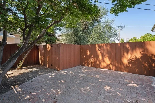 a view of backyard with tree