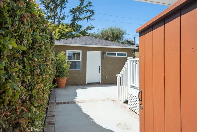 a view of backyard with a small cabin and a chair