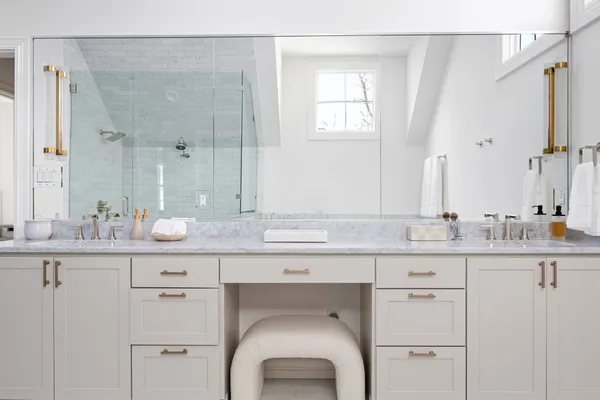 a bathroom with a granite countertop sink mirror and a