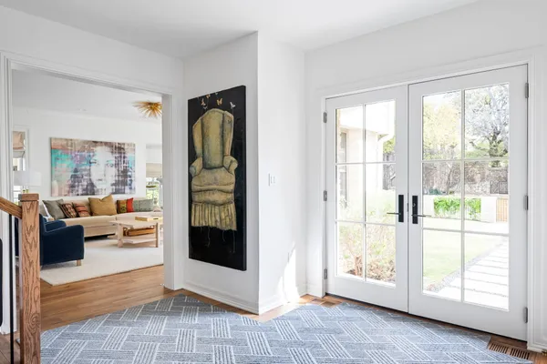 a view of a livingroom with furniture and front door