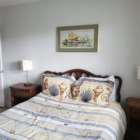 a white toilet sitting next to a bath tub