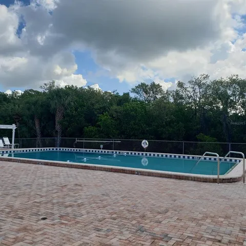 a lawn chairs sitting on a roof deck