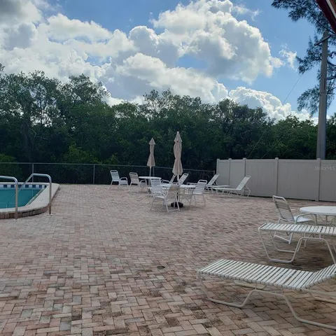 a kitchen with lots of counter top space and furniture