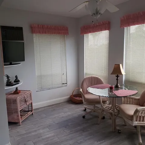 a room with furniture and a flat screen tv