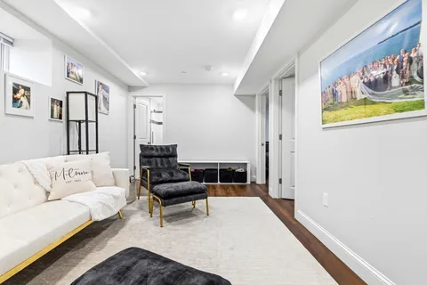 a living room with furniture and a rug
