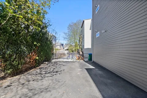 a view of a backyard with sitting area