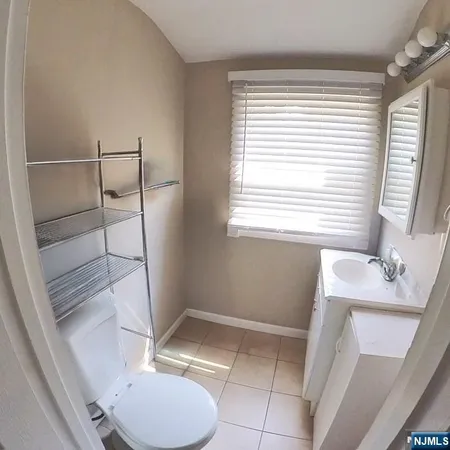 a bathroom with a sink toilet and tub