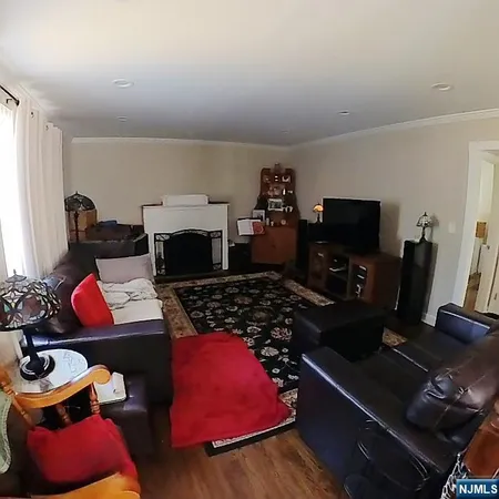 a room with furniture and a flat screen tv
