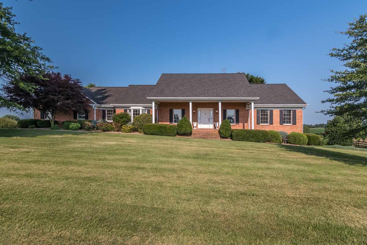 158 Battlefield Road Waynesboro, VA 22980 - Photo 1 of 50 a front view of a house with a garden