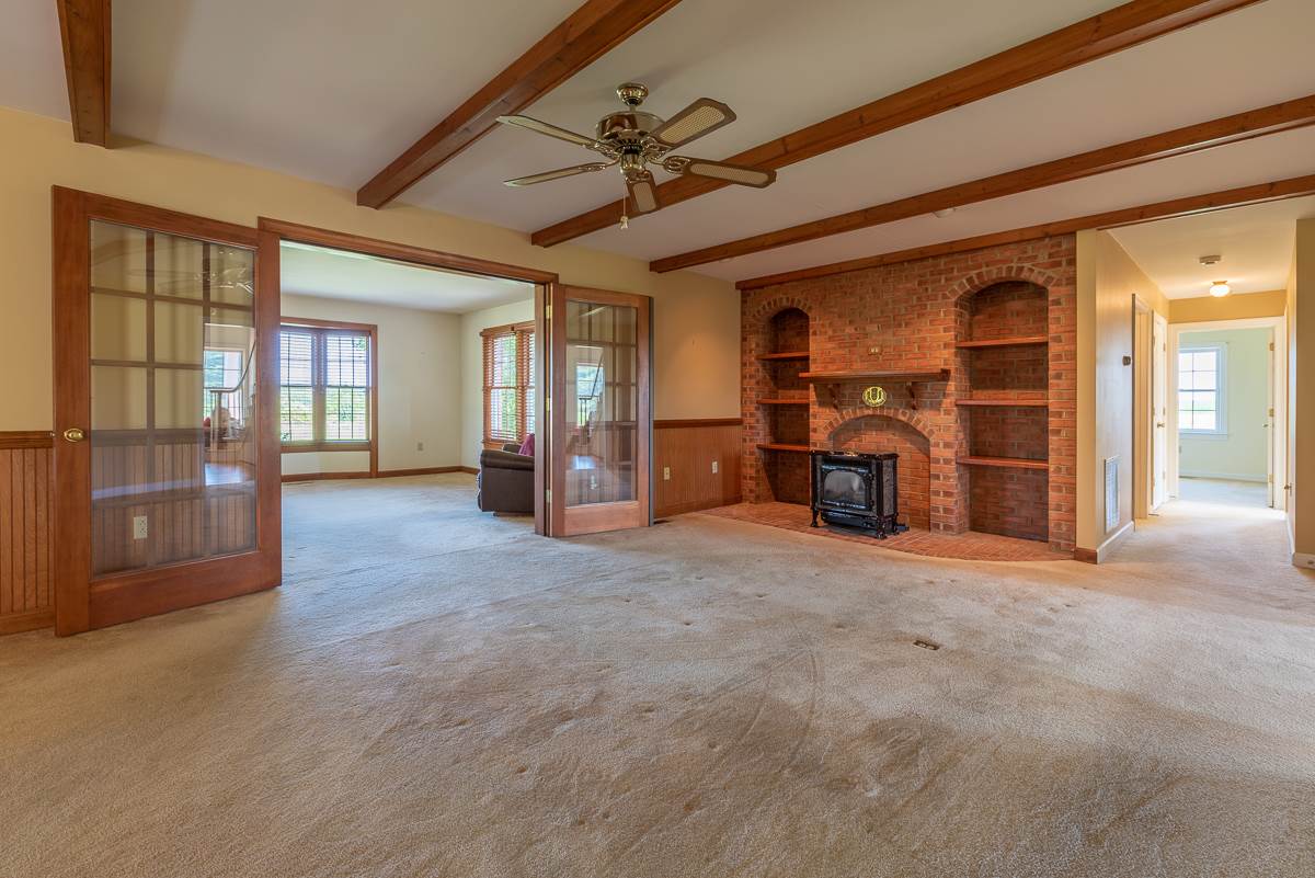 158 Battlefield Road Waynesboro, VA 22980 - Photo 27 of 50 an empty room with furniture and a fireplace