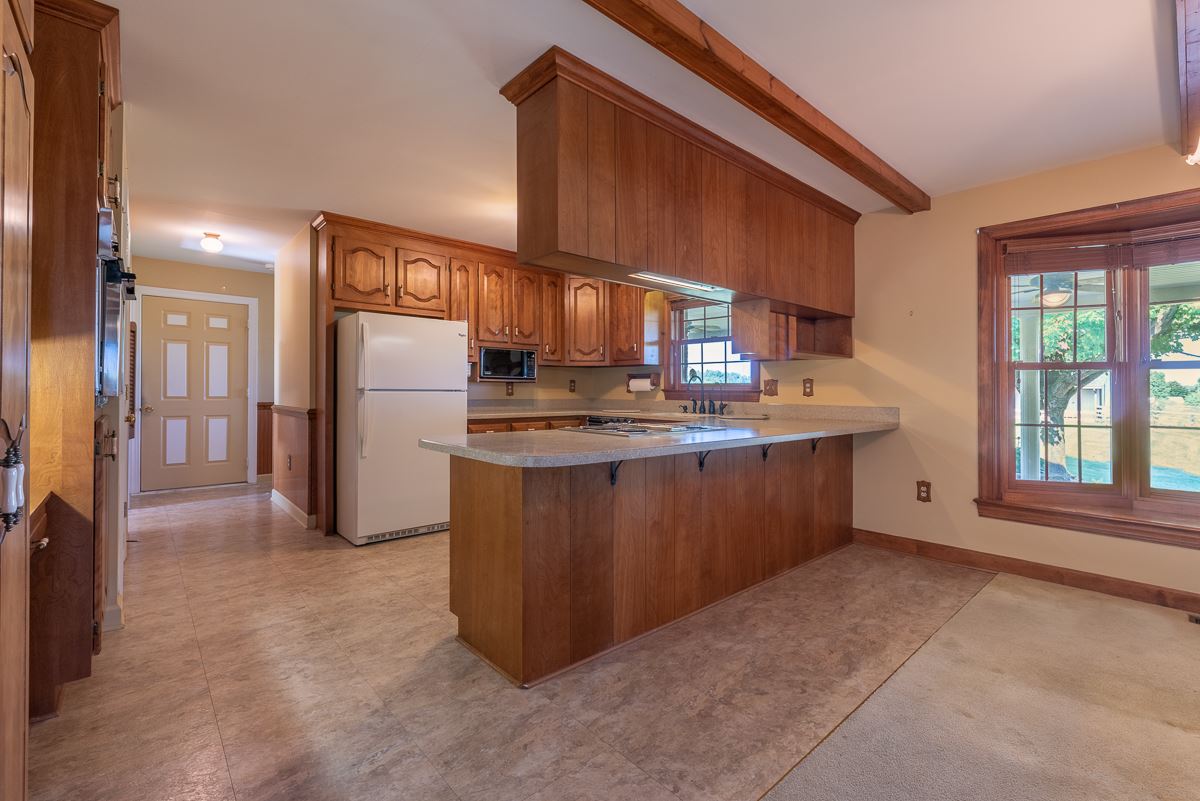 158 Battlefield Road Waynesboro, VA 22980 - Photo 32 of 50 a kitchen with stainless steel appliances granite countertop a refrigerator a sink a stove and a refrigerator