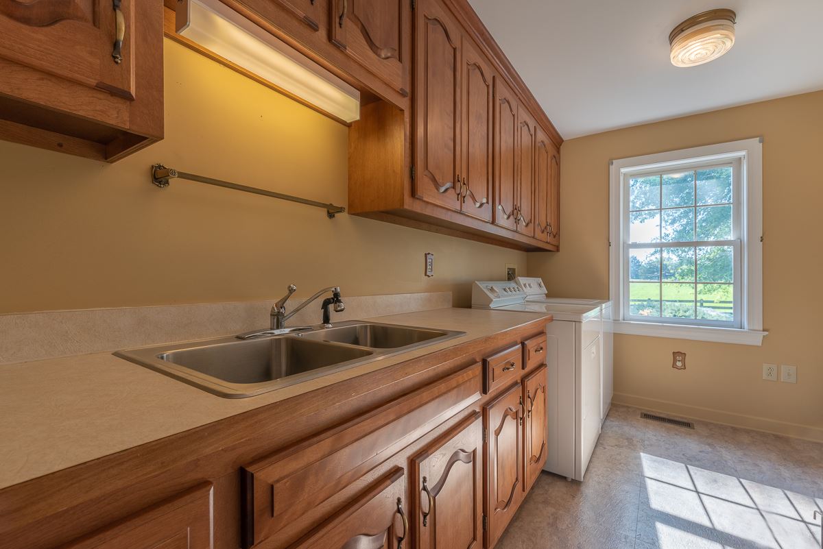 158 Battlefield Road Waynesboro, VA 22980 - Photo 36 of 50 a kitchen with a sink and cabinets