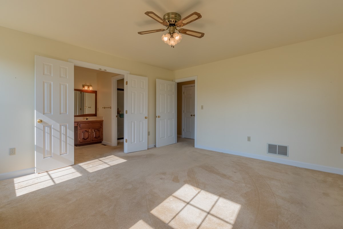 158 Battlefield Road Waynesboro, VA 22980 - Photo 38 of 50 a view of a livingroom with a ceiling fan and window