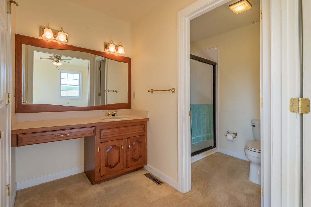 158 Battlefield Road Waynesboro, VA 22980 - Photo 39 of 50 a bathroom with a sink and a mirror
