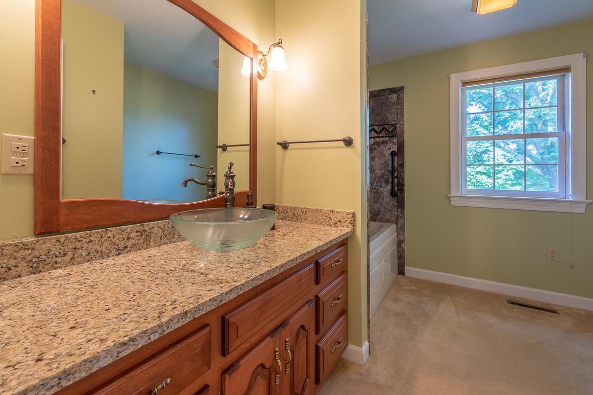 158 Battlefield Road Waynesboro, VA 22980 - Photo 41 of 50 a bathroom with a granite countertop sink and a mirror