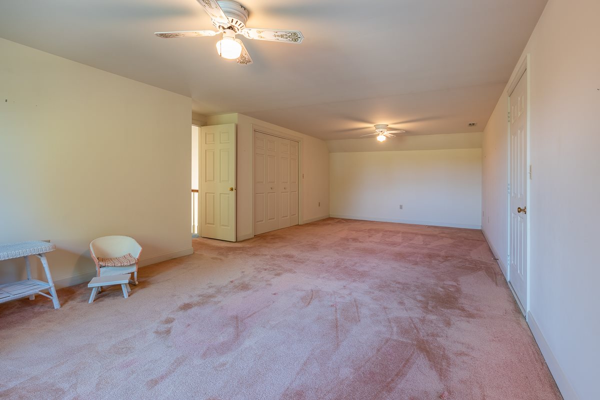 158 Battlefield Road Waynesboro, VA 22980 - Photo 45 of 50 a view of a livingroom with a chair and a fan