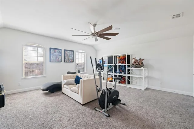 a view of a livingroom with furniture and a window