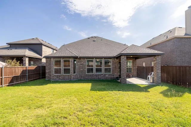 a view of a house with swimming pool and porch with furniture