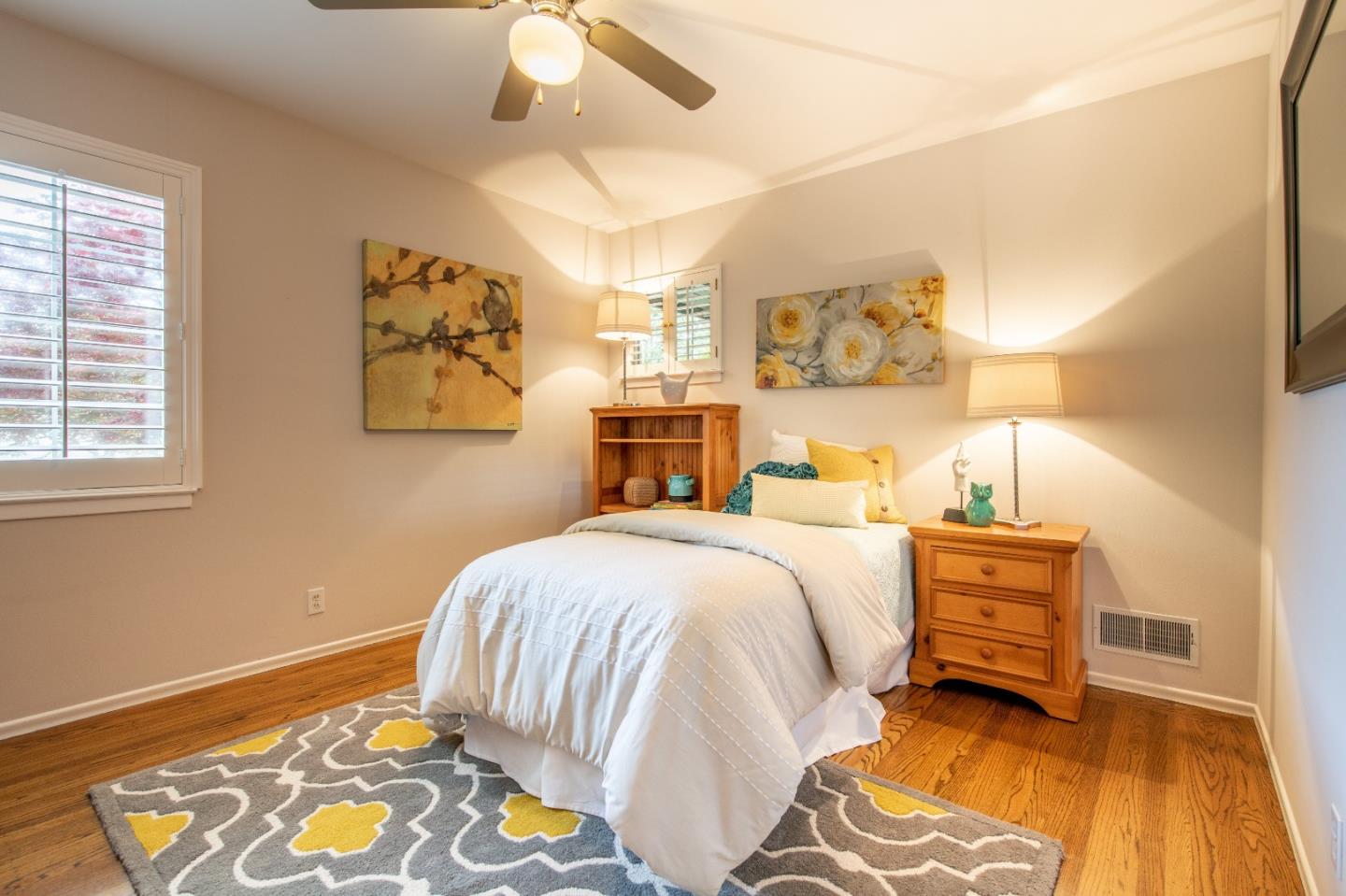 500 Yale Drive San Mateo, CA 94402 - Photo 17 of 35 a bedroom with a bed and wooden floor