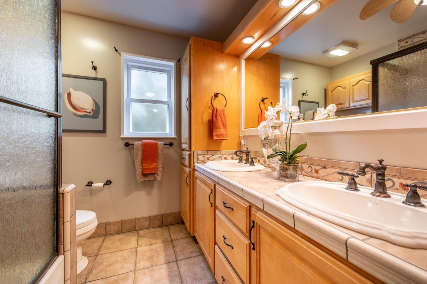 500 Yale Drive San Mateo, CA 94402 - Photo 19 of 35 a spacious bathroom with a double vanity sink mirror and toilet