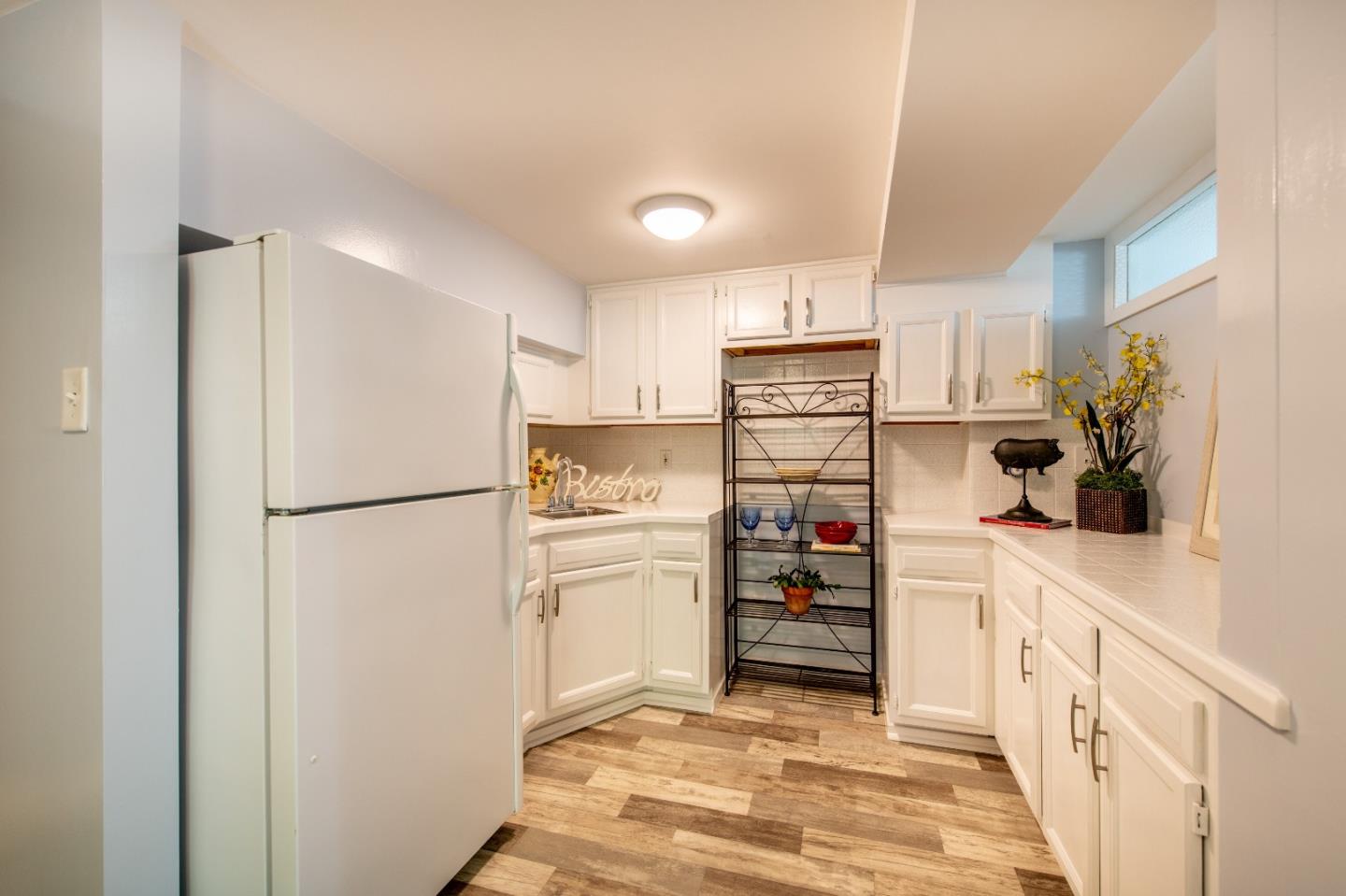 500 Yale Drive San Mateo, CA 94402 - Photo 23 of 35 a kitchen with stainless steel appliances a refrigerator sink and cabinets