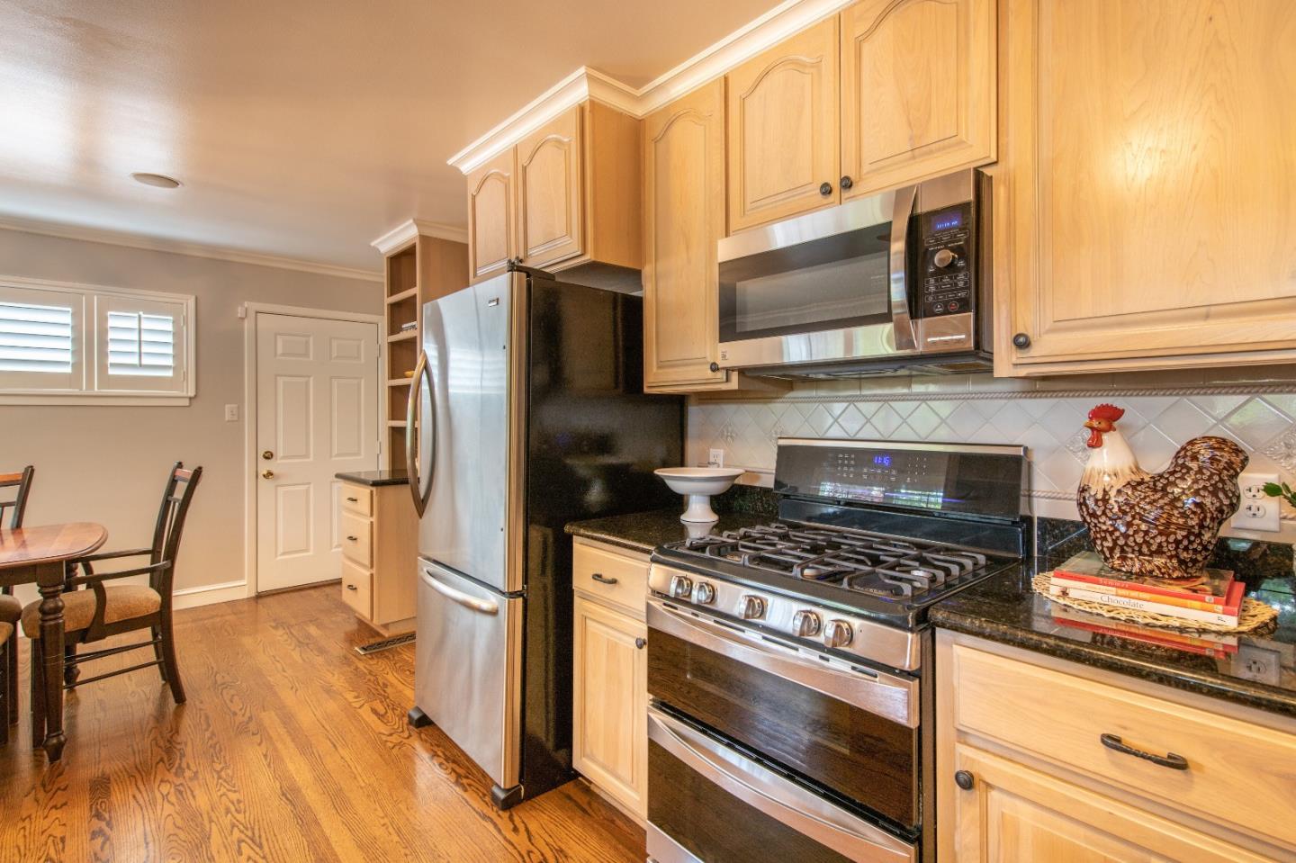 500 Yale Drive San Mateo, CA 94402 - Photo 10 of 35 a kitchen with stainless steel appliances a stove a microwave and a refrigerator