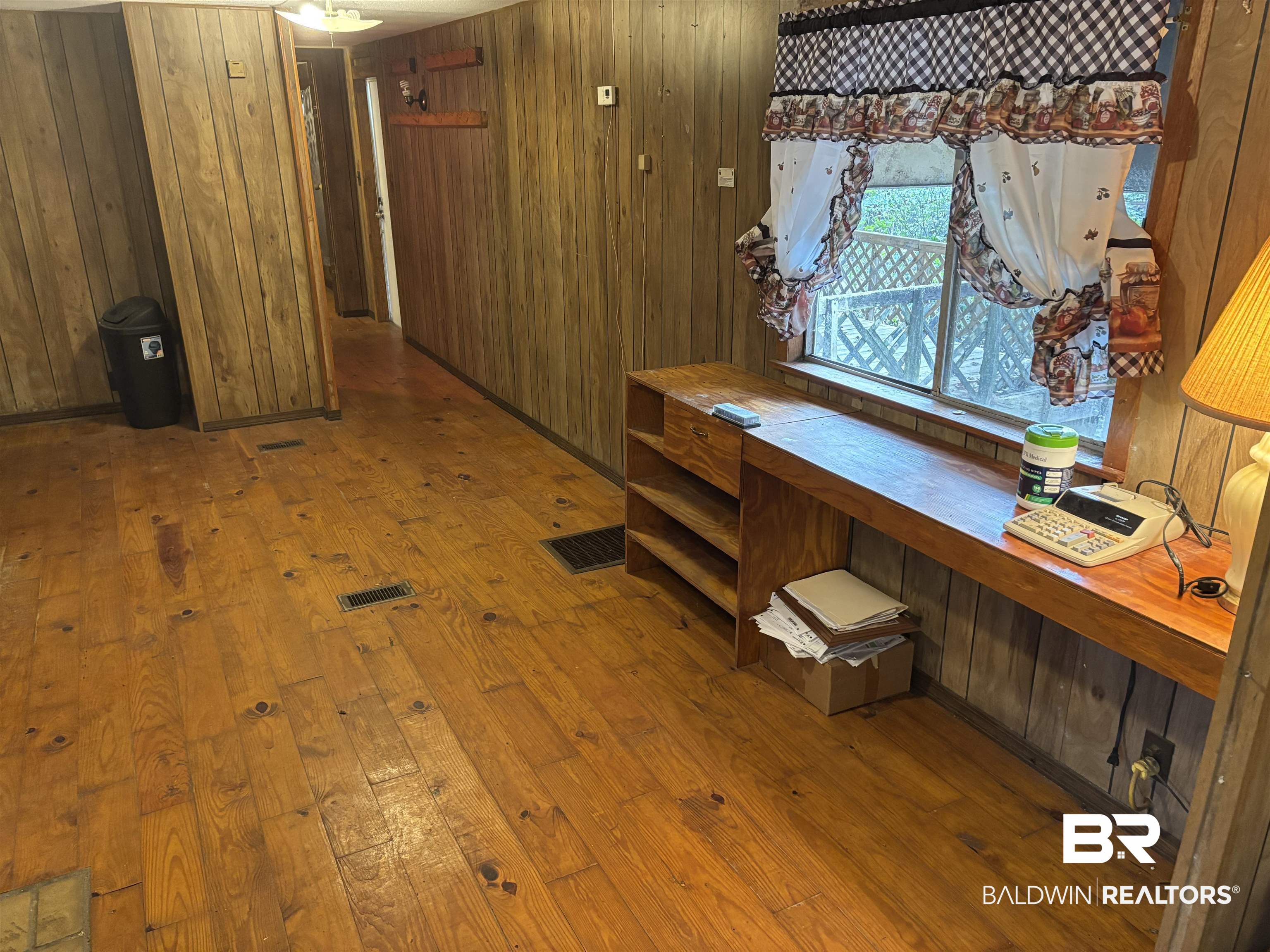 15575 Rogers Drive Chunchula, AL 36521 - Photo 28 of 42 Interior space featuring hardwood / wood-style flooring, visible vents, and wood walls