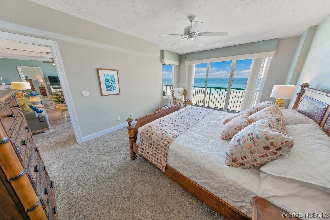 4575 South Atlantic Avenue, Unit 6307 Ponce Inlet, FL 32127 - Photo 17 of 36 a bedroom with a large bed and a window
