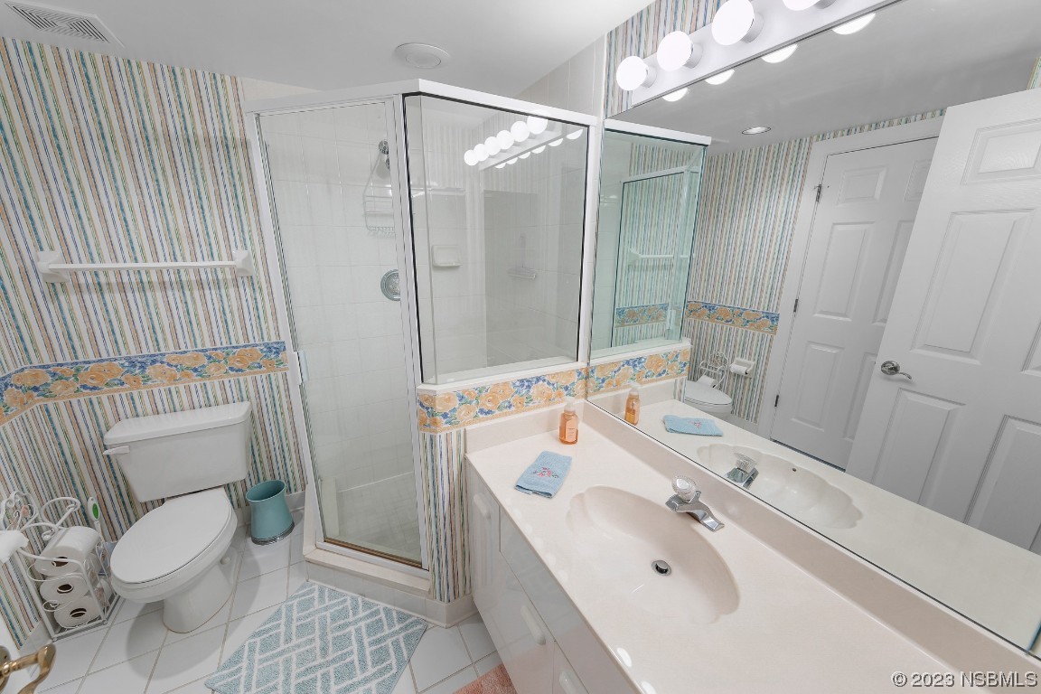 4575 South Atlantic Avenue, Unit 6307 Ponce Inlet, FL 32127 - Photo 27 of 36 a bathroom with a sink toilet and shower