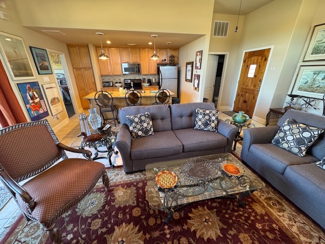 1908 Kahala Sunset Drive, Unit A Spicewood, TX 78669 - Photo 2 of 14 a living room with furniture and a rug