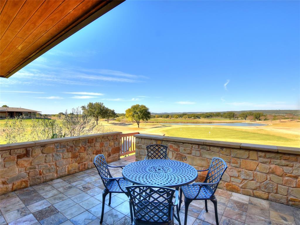 1908 Kahala Sunset Drive, Unit A Spicewood, TX 78669 - Photo 10 of 14 a view of a swimming pool and an ocean from a balcony