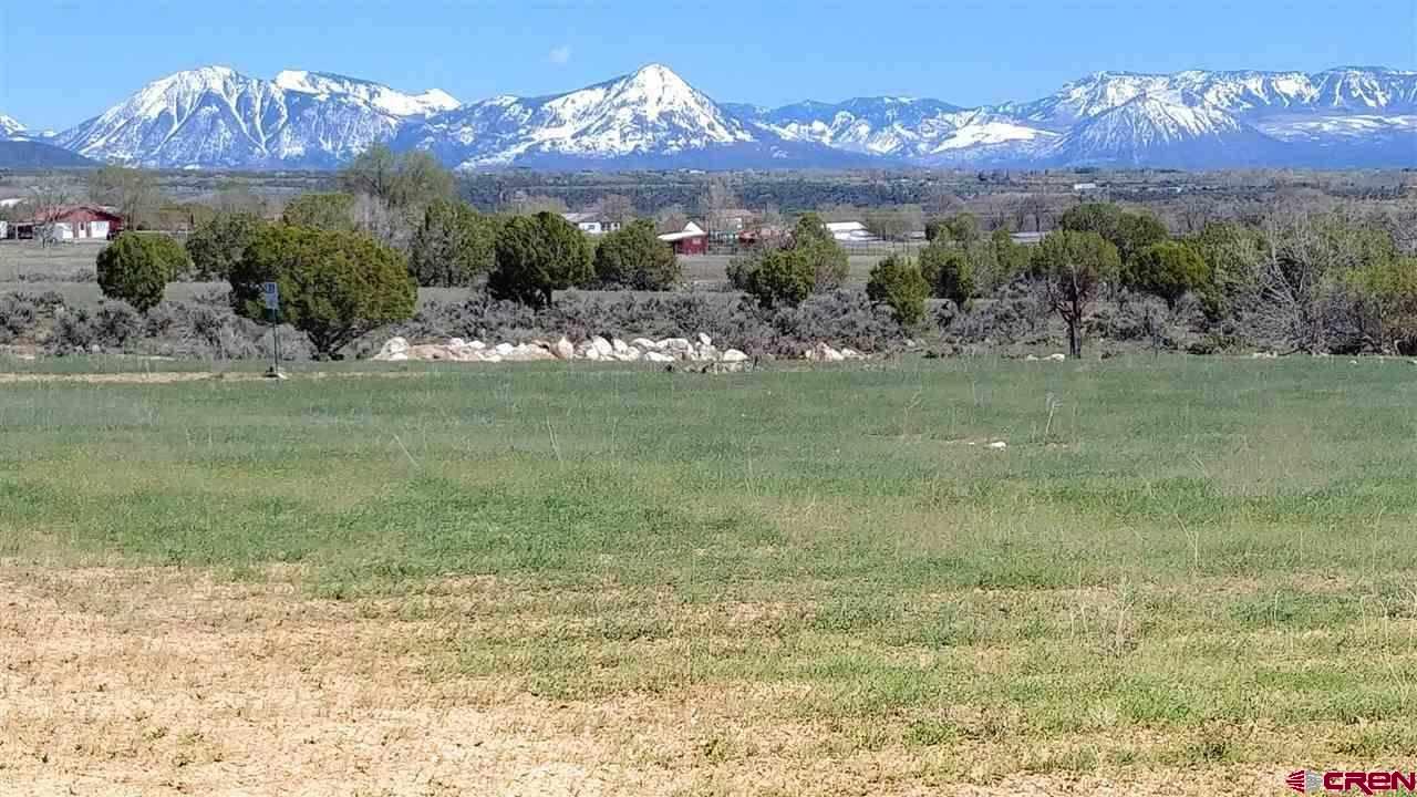 Lot 7 Pine Ridge Road Cedaredge, CO 81413 - Photo 1 of 1 a view of a fountain in middle of the green field
