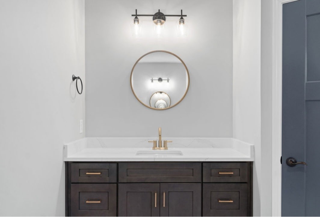 4807 Hunter Road Southside, TN 37171 - Photo 12 of 23 a bathroom with a sink and a mirror