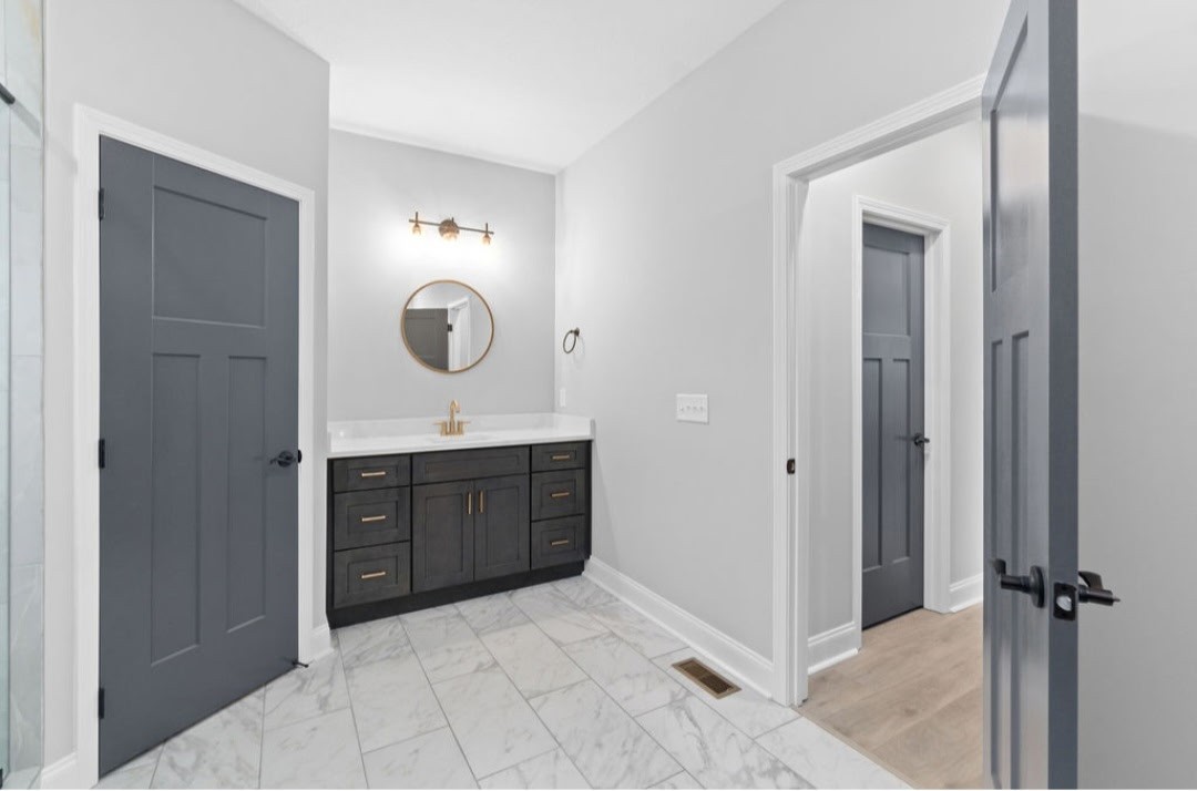 4807 Hunter Road Southside, TN 37171 - Photo 13 of 23 a spacious bathroom with a sink and a mirror