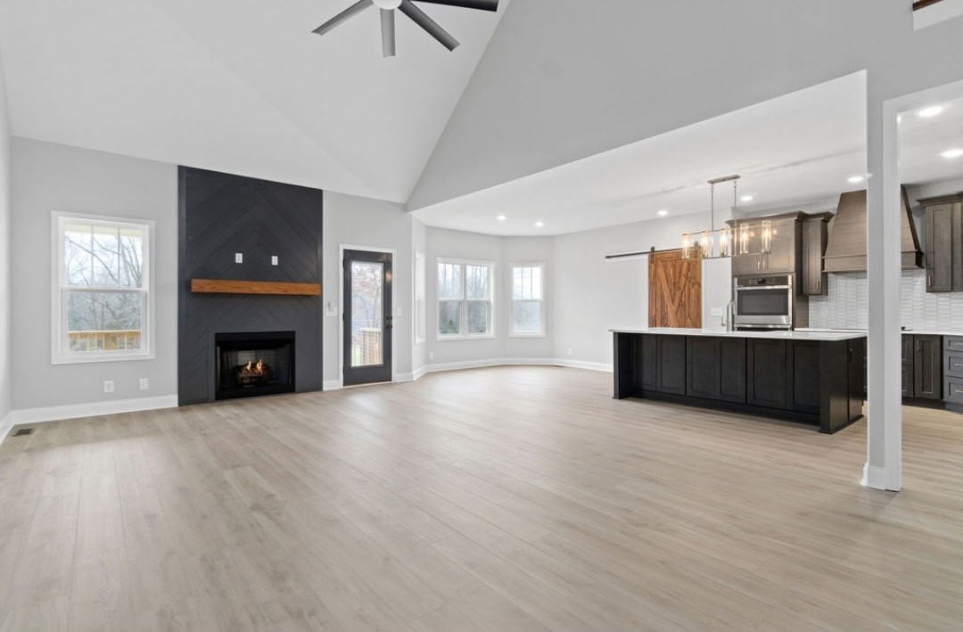 4807 Hunter Road Southside, TN 37171 - Photo 7 of 23 a view of an empty room with a fireplace and a window