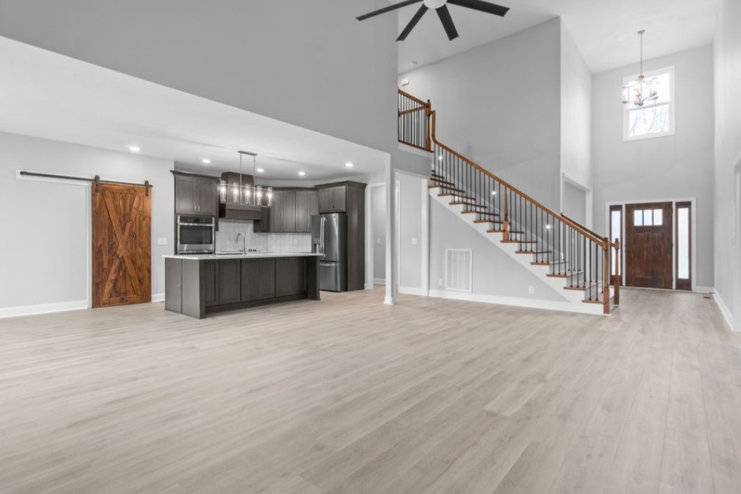4807 Hunter Road Southside, TN 37171 - Photo 8 of 23 a view of a kitchen with a sink and a living room