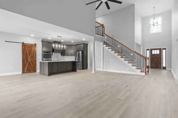 a view of a kitchen with a sink and a living room