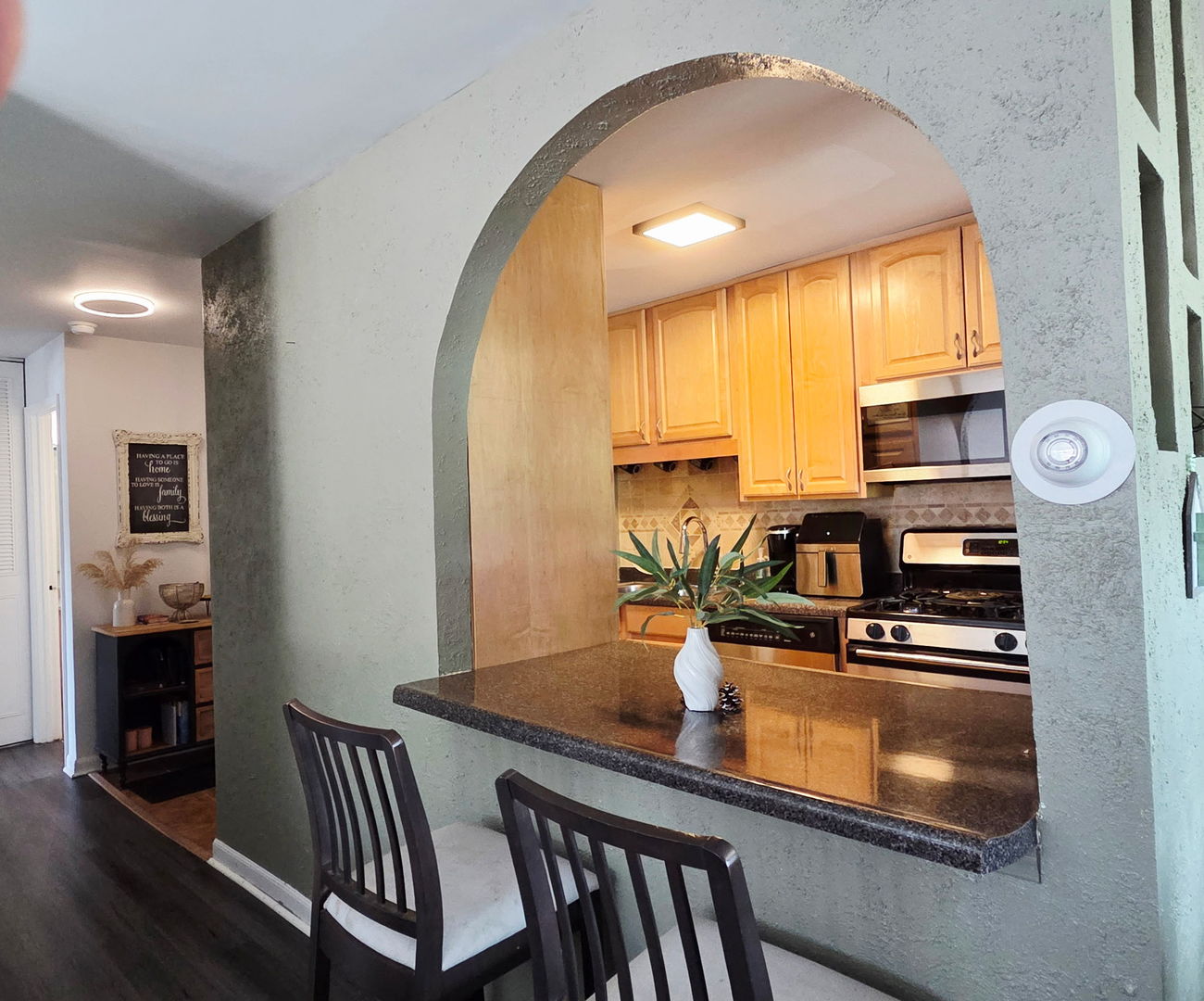 1217 South Old Wilke Road, Unit 201 Rolling Meadows, IL 60005 - Photo 5 of 26 a kitchen with table and chairs
