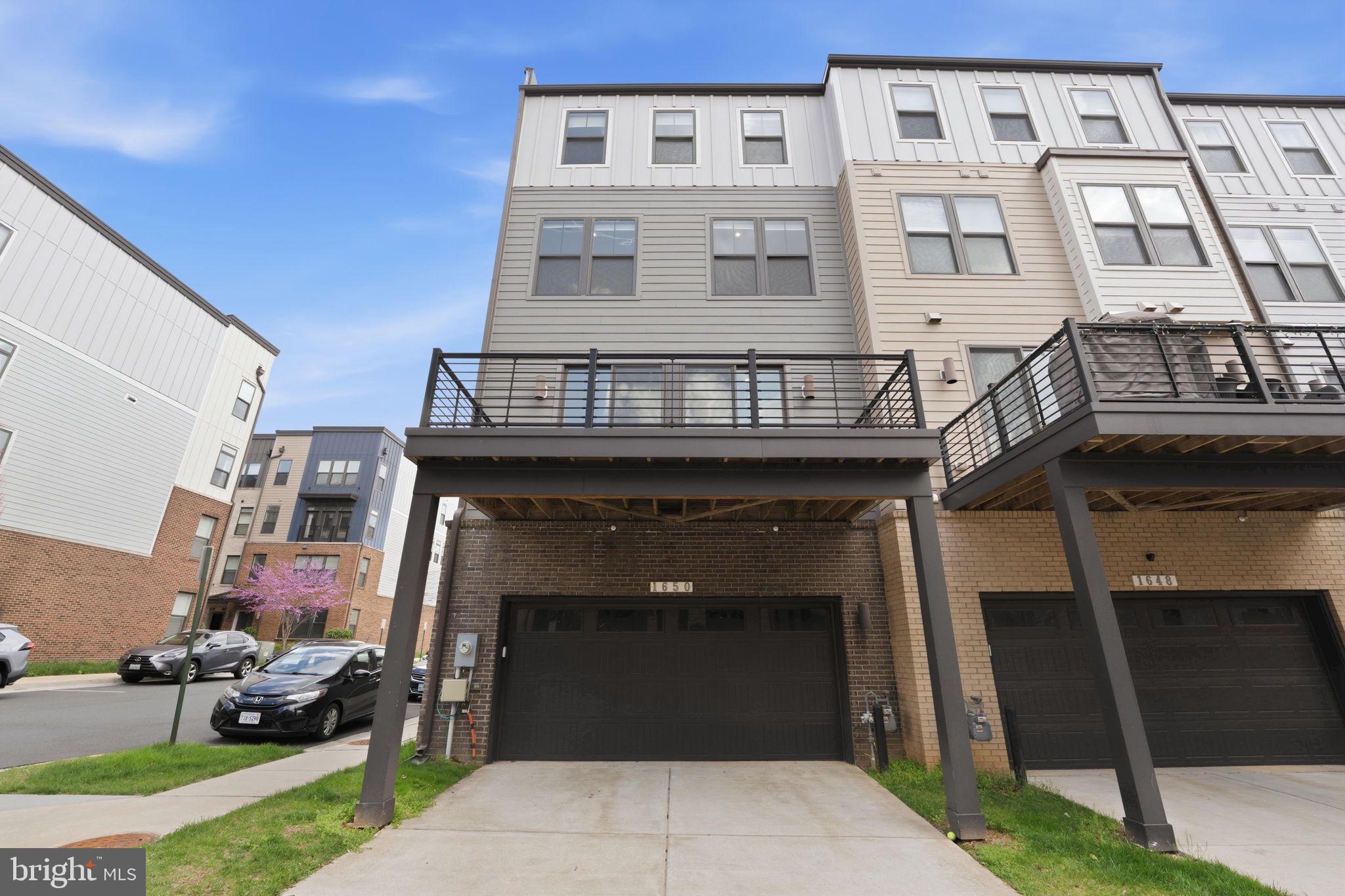 1650 Bandit Loop Reston, VA 20190 - Photo 34 of 38 Two car garage and driveway