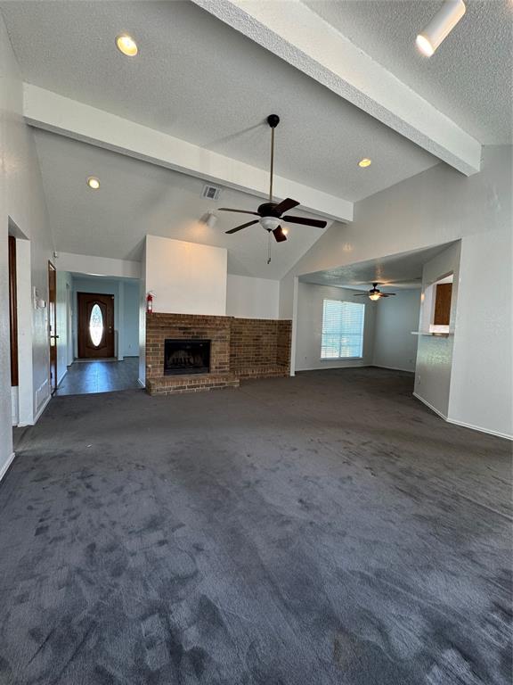 5824 Emrose Terrace Dallas, TX 75227 - Photo 2 of 11 an empty room with fireplace and windows