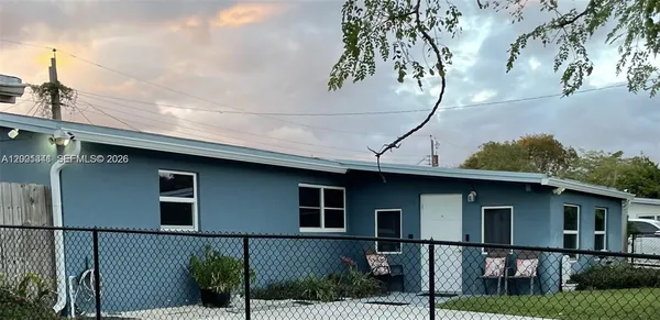 a front view of a house with garage