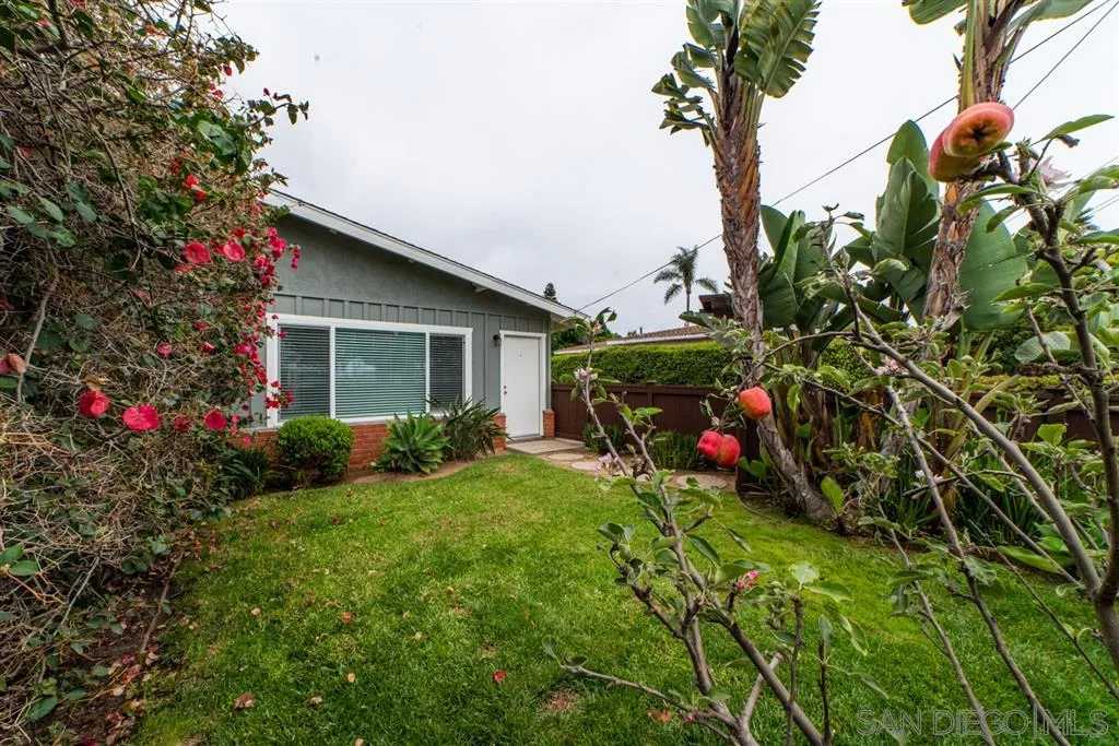 1095-99 Regal Road Encinitas, CA 92024 - Photo 4 of 21 a view of a house with a backyard and garden
