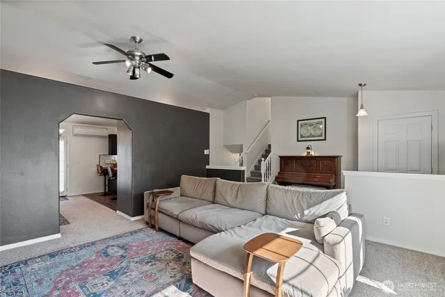 a living room with furniture and a rug
