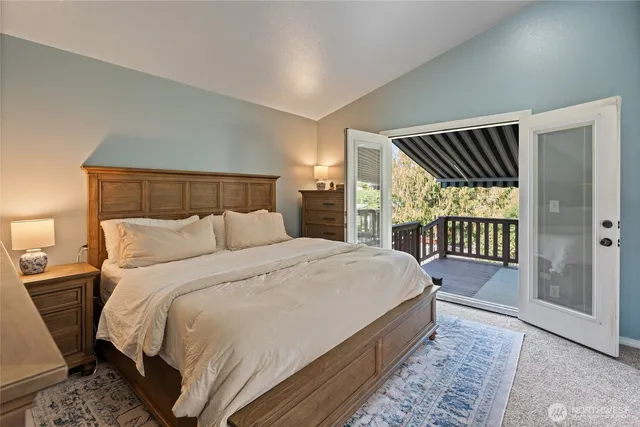 a bed room with a bed and a window