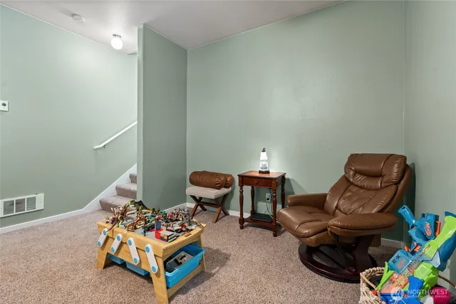 a living room with furniture and a couch