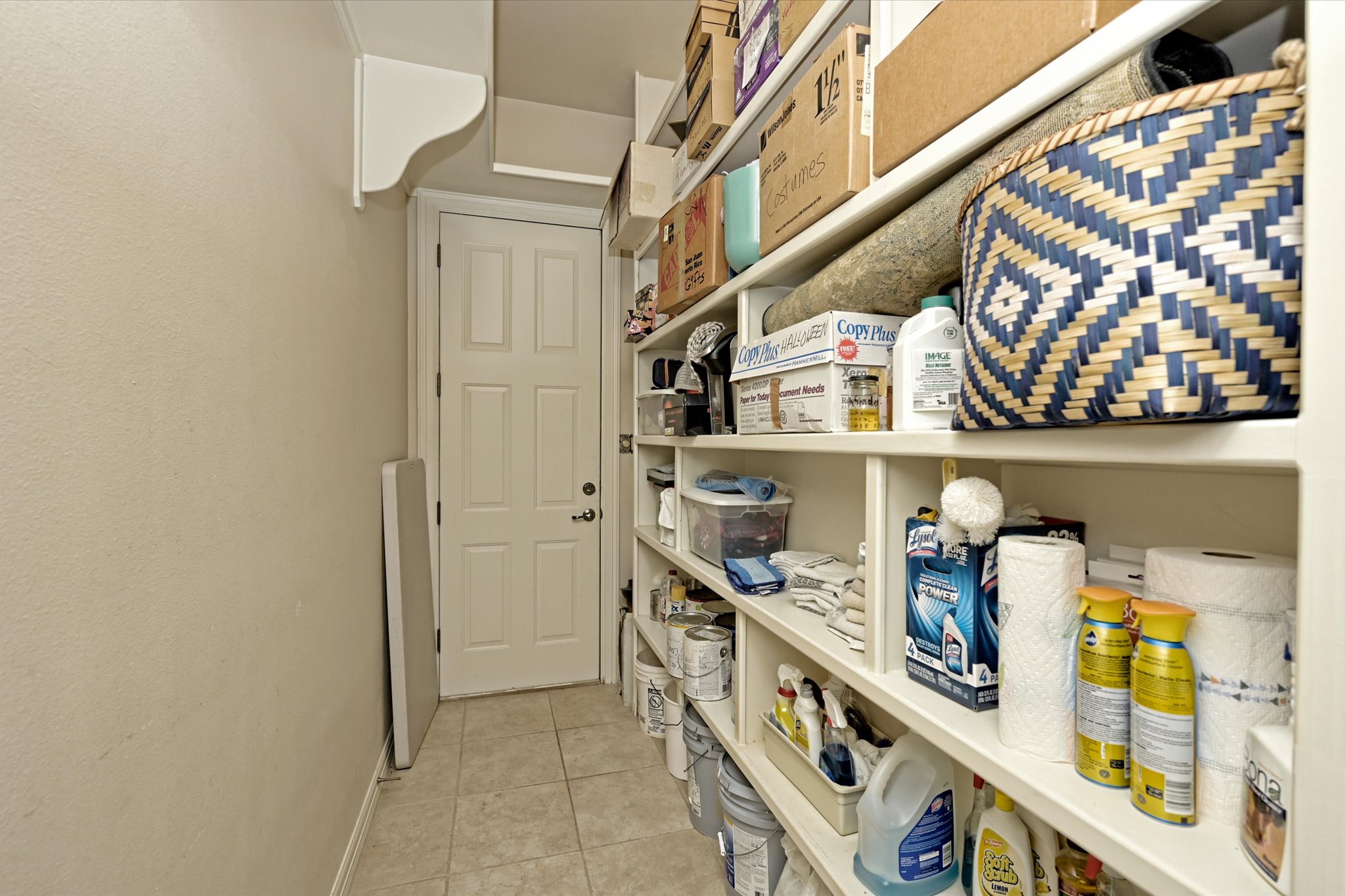 4912 Interlachen Lane Austin, TX 78747 - Photo 12 of 39 a hallway with lots of clutter and cabinets