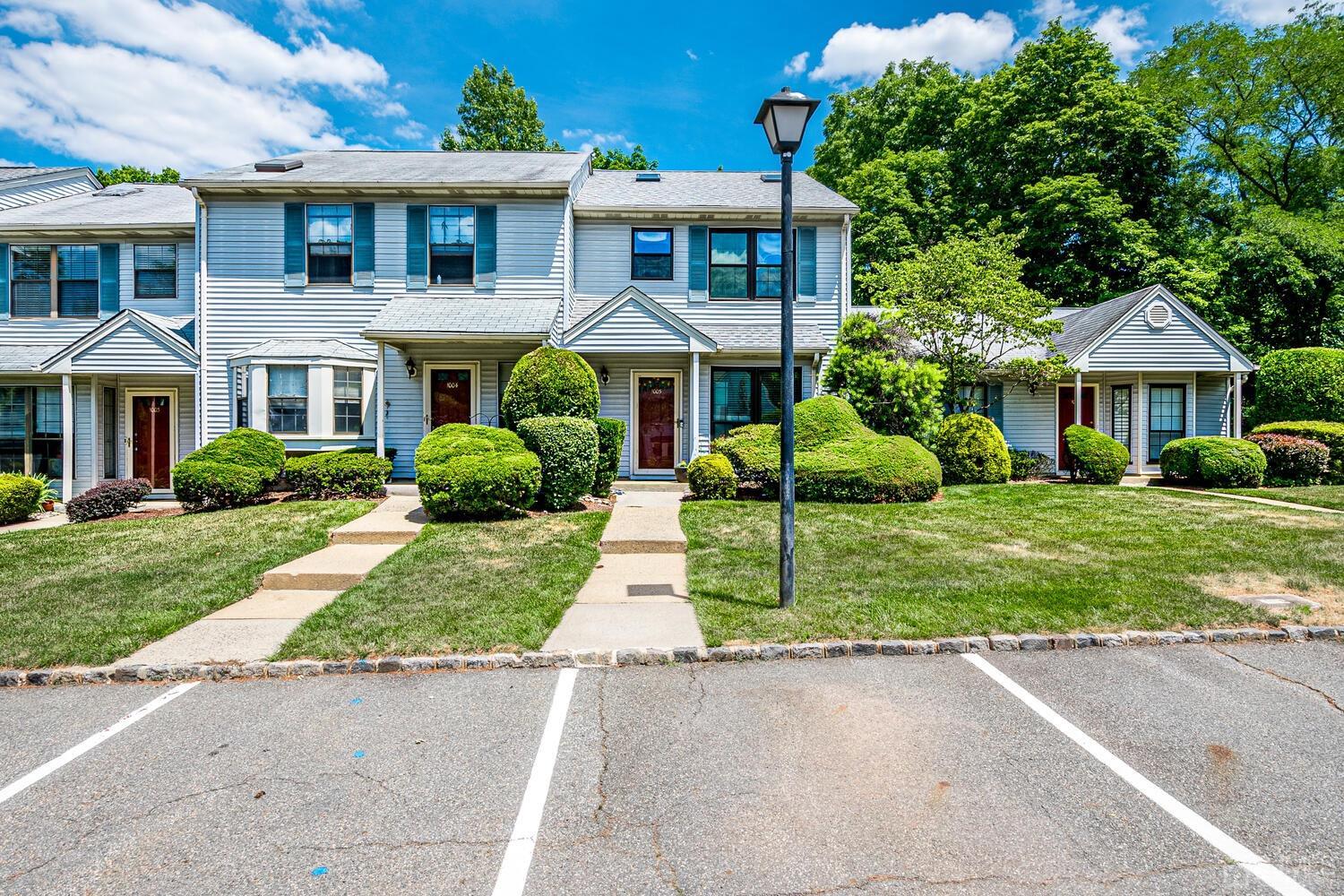 1005 Maplecrest Road Edison, NJ 08820 - Photo 1 of 48 a front view of a house with a yard