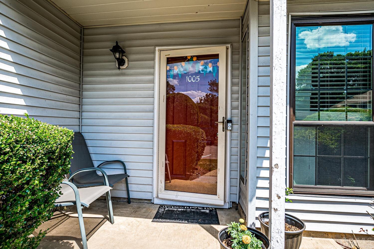 1005 Maplecrest Road Edison, NJ 08820 - Photo 11 of 48 a view of a porch with a table and chairs