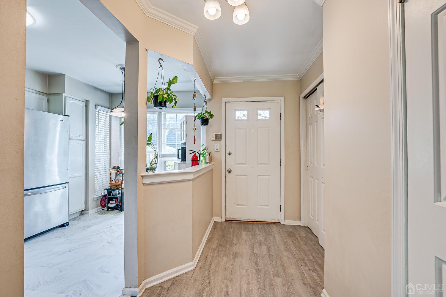 1005 Maplecrest Road Edison, NJ 08820 - Photo 13 of 48 a view of a kitchen and a refrigerator a stove top oven